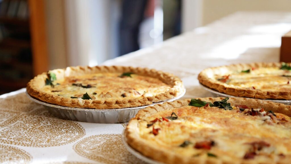 Three round pies on a table and table cloth